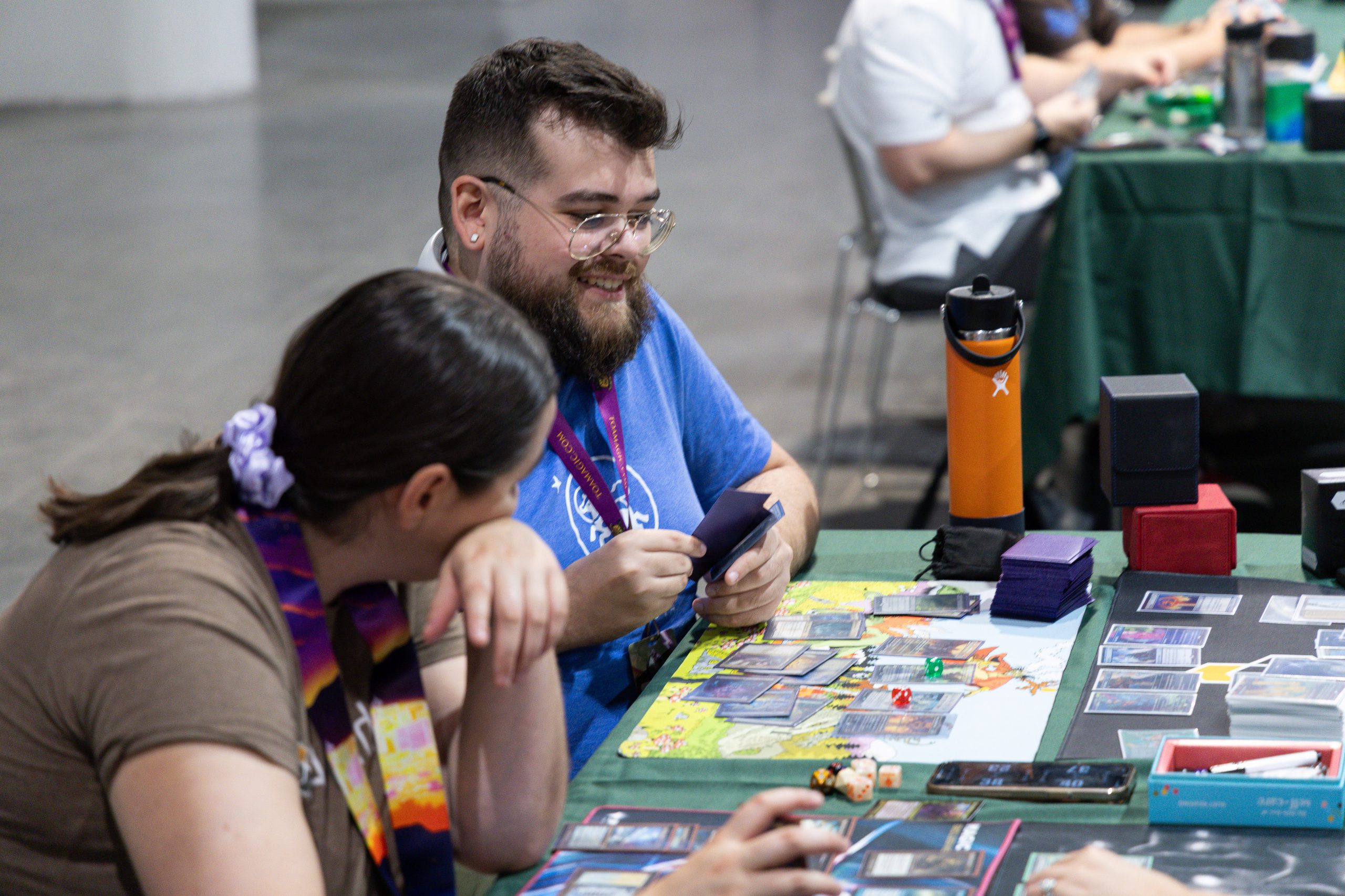 Two players share a laugh at the Command Zone in MagicCon Vegas 2025.