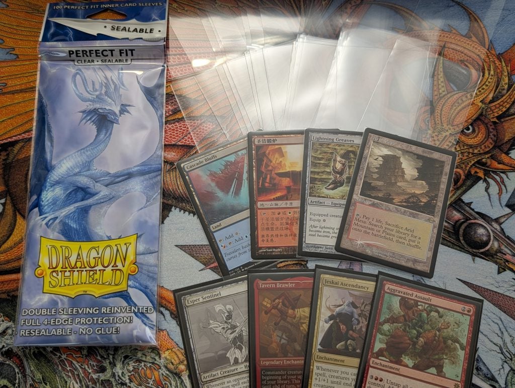 Sealable Perfect Fit sleeves by Dragon Shield. Top row is the sleeves, middle row is Magic cards in only the Sealable Perfect Fit sleeves, and the bottom row is sleeved in the Sealable Perfect Fits as well as regular Dragon Shield sleeves.