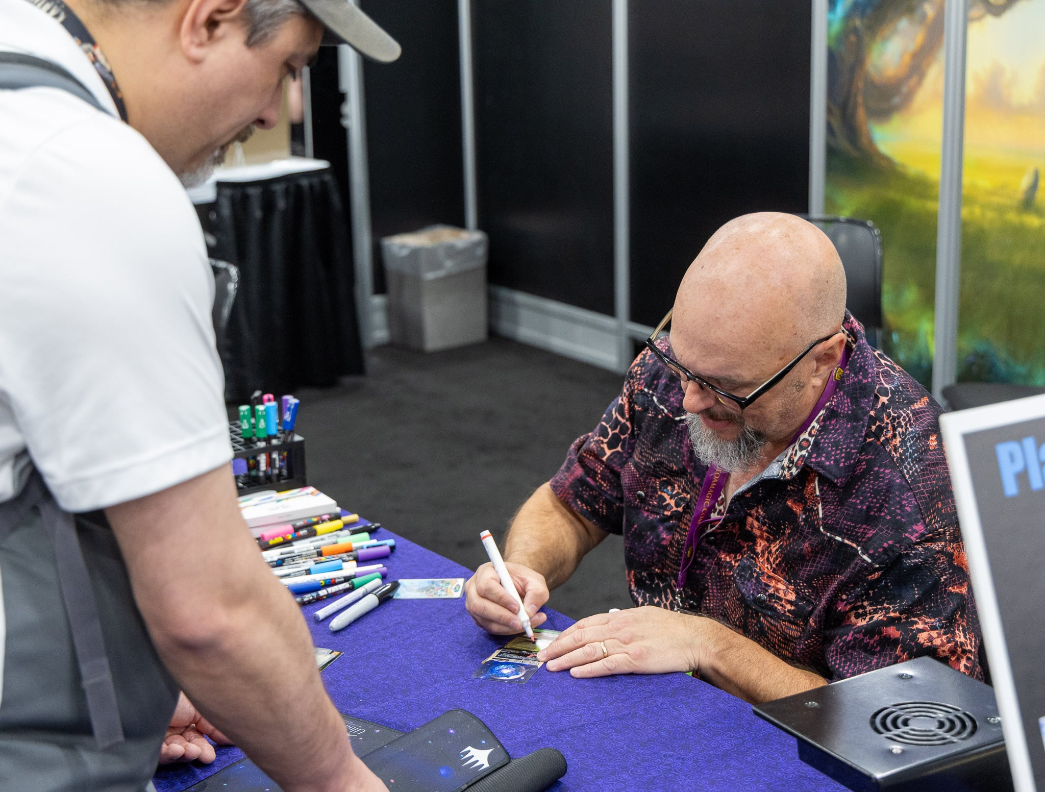 Mark Poole signs for a fan.